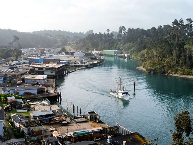 A fishing vessel leaves Noyo Harbor in Fort Bragg.