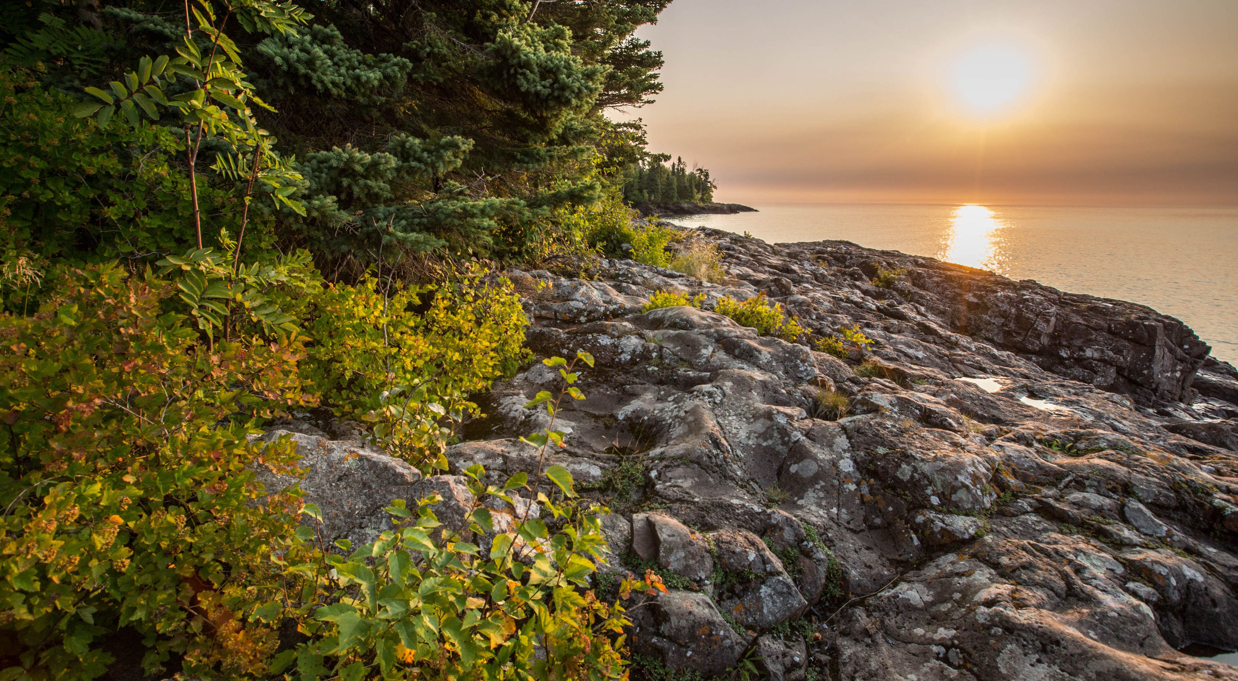 The sun sets over Lake Superior on Lake Superior’s North Shore in Minnesota along the Boundary Waters.