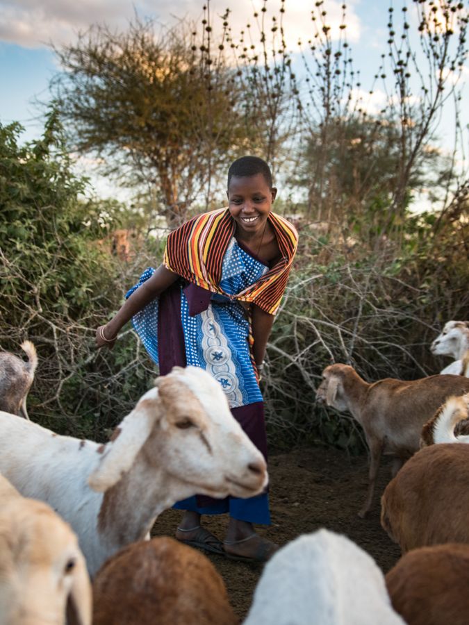 A young girl with goats in northern Tanzania.