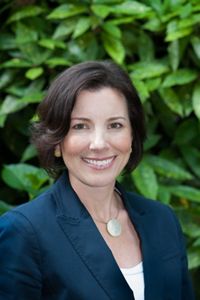 Alix Murdoch in a suit