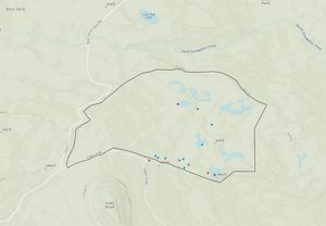 Topographic map showing an irregularly shaped section with orange dots highlighting specific points of interest.