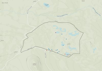 Topographic map showing an irregularly shaped section with orange dots highlighting specific points of interest.