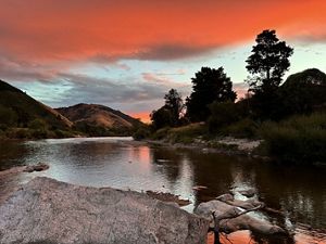 A red cloud sunset across the river