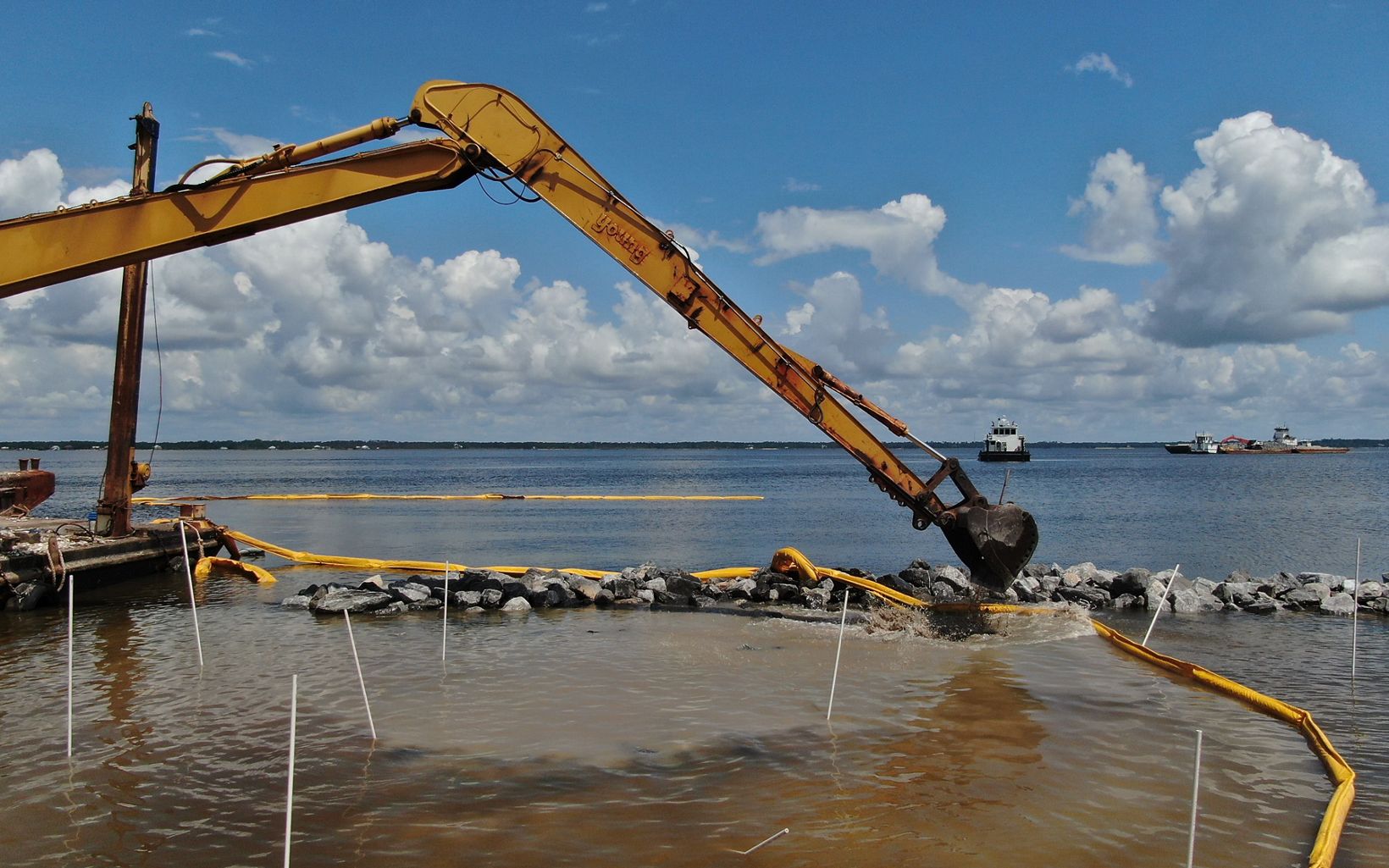 Reef Construction An excavator works on installing the last reefs in Blackwater Bay. © Russell C. Mick