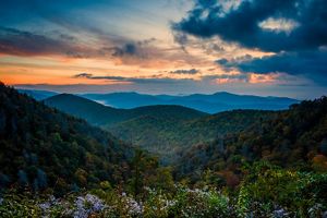 North Carolina landscape view of a forest with hills and valleys at sunset.