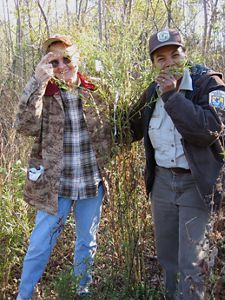 Dr. Marian Smith (left) and Gwen Kolb (right) standing in tall grass at Meredosia National Wildlife Refuge in 2005.