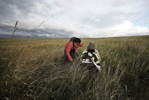 Two people in grasslands. 