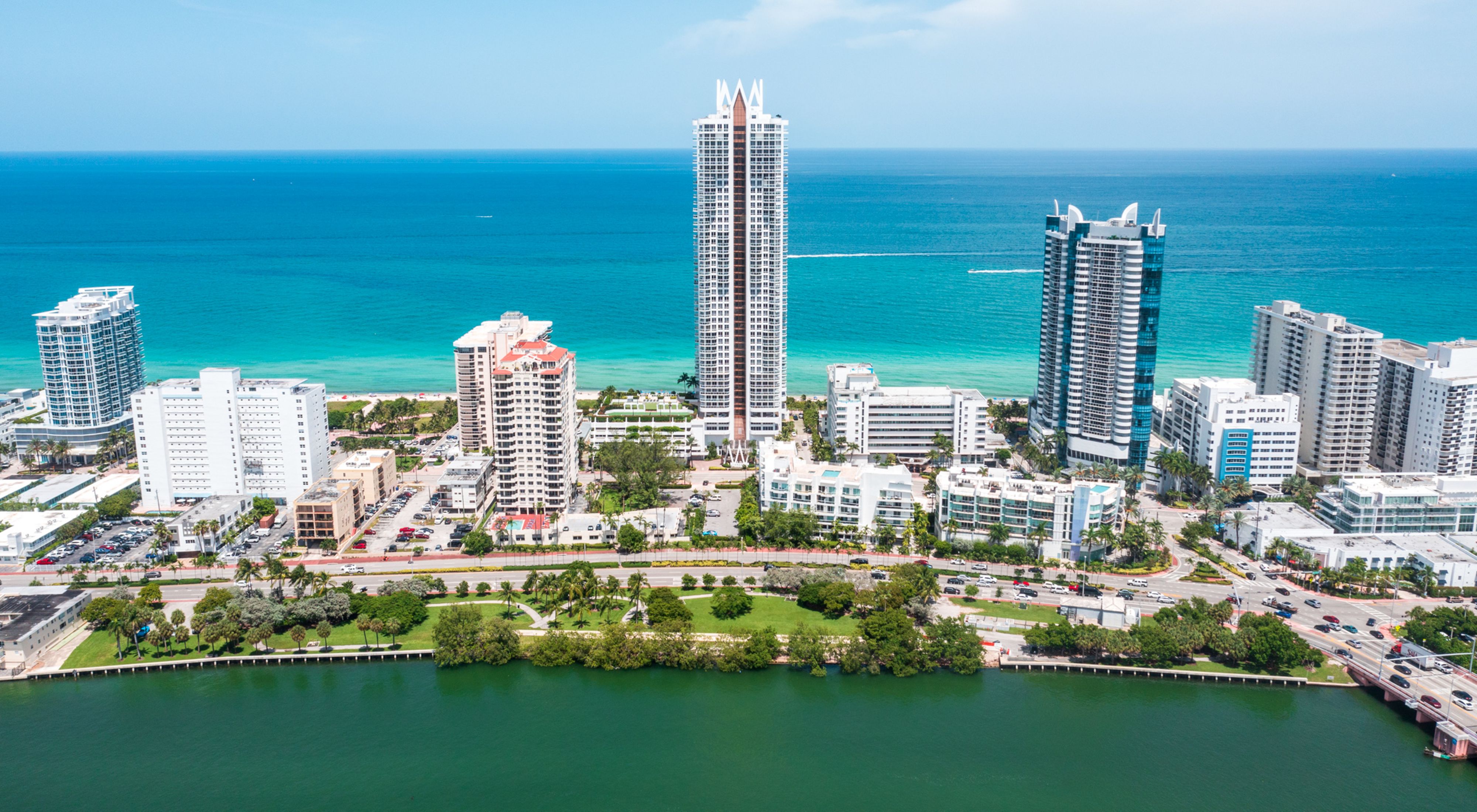 Aerial view of Brittany Bay Park in Miami Beach, which sits along the shoreline with high-rise buildings behind it.