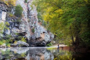 Man fishing on the shore of the Buffalo National River.