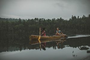 Two people paddling a canoe within the boundary waters of the Superior National Forest that provides a climate resilient landscape for wildlife and outdoor recreation.