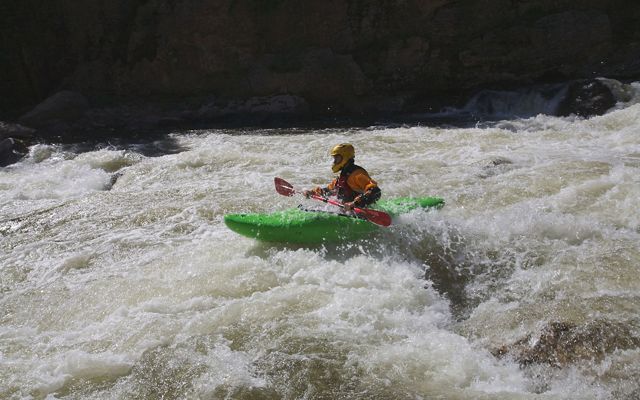 River kayaker on the Cache la Poudre River in Colorado