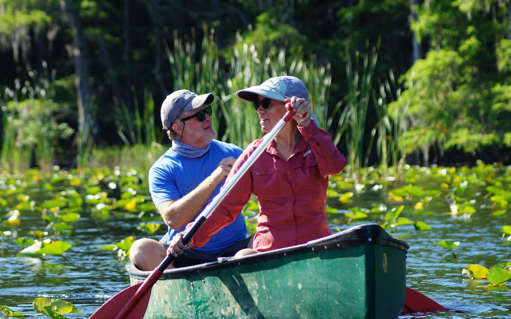 Wood Stork Monitoring Central Florida land conservation manager Adam Peterson and coordinator Cody-Marie Miller row a canoe on Lake Russell to conduct annual monitoring of the wood stork rookery.   © Hannah O'Malley/TNC