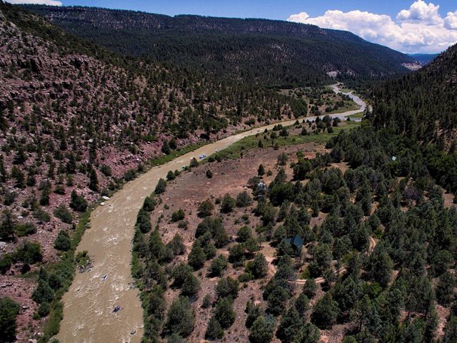 Photo of a sweeping view of Rio Chama river between mountains in New Mexico.