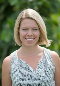 A woman poses for a picture.