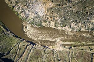 An aerial image of a river flowing through the ground.