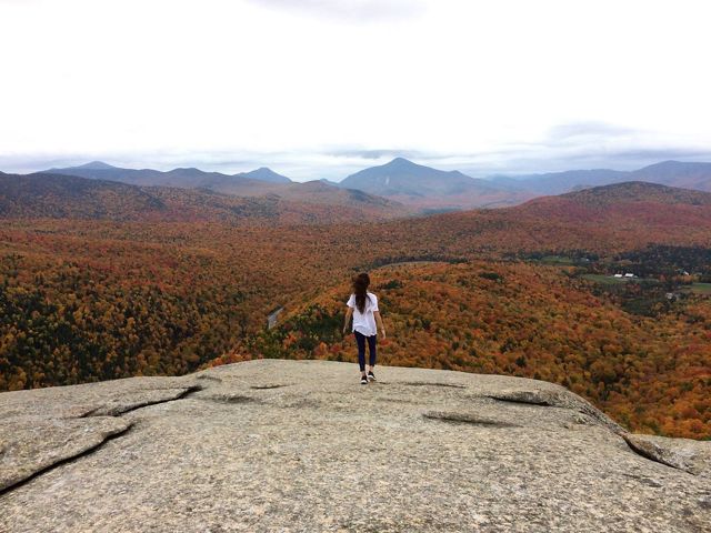 Person overlooking Adirondack Mountains.
