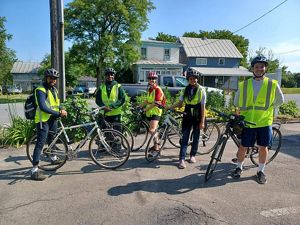 A group of people on bikes facing the camera. 