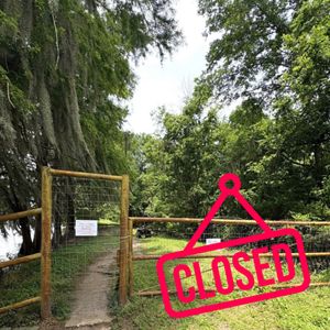 A "closed" graphic is added to an image of a nature trail. 