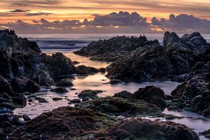 A rocky ocean vista at sunset