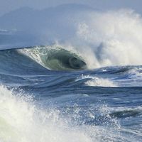 Crashing blue ocean waves side view