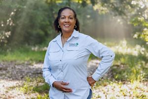 A woman with a blue striped shirt. 