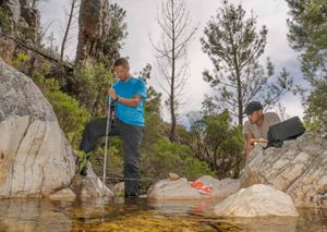 man checking hydrological equipment 