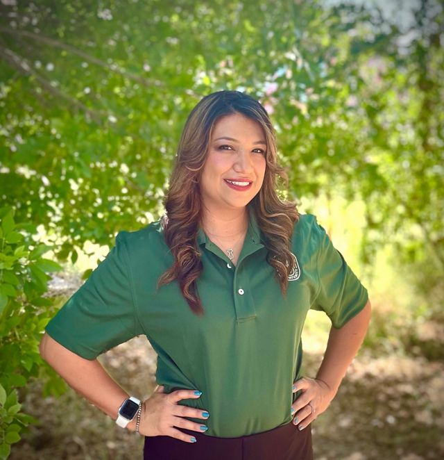 Diana Apresa wearing a green shirt.