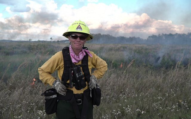 Cody-Marie Miller in fire gear at a controlled burn.