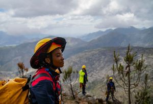 Alungile Mayekiso scouts the cliff area.