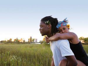 Veasna Johnson and Anthony Okocha celebrate the first day of summer with a picnic at Chicago’s Montrose Beach Dunes, Illinois.
