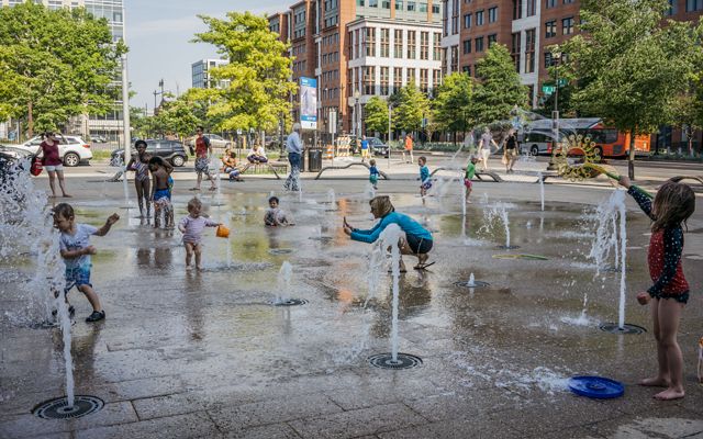 Children play on a splash pad in Washington, DC.