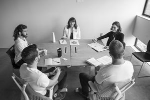 Techstars participants and mentors seated around a table