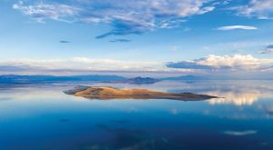 An island in a blue lake.