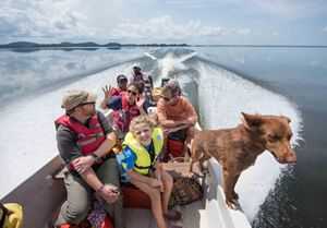 A group of people in a motorboat 