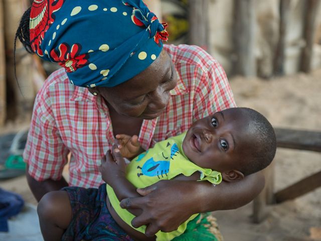 Charity Siankuku with her 1-year-old grandson, Joseph, at Kapunda Village, Mulobezi, Zambia.