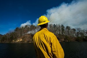 Conservation tech Austin Wiliams observes a controlled burn.