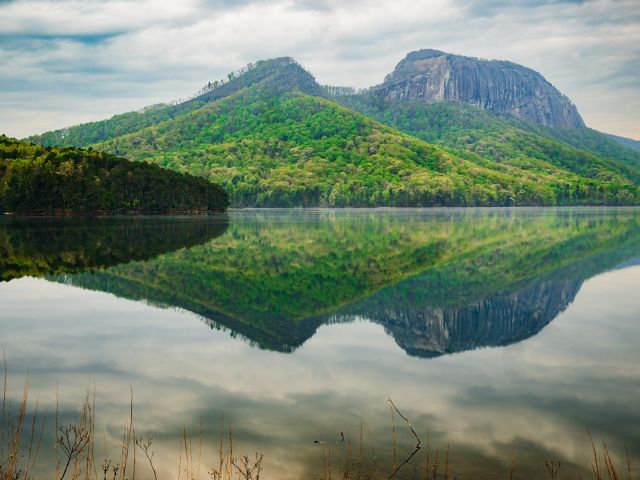 Hills reflected in the water at the Table Rock Reservoir.