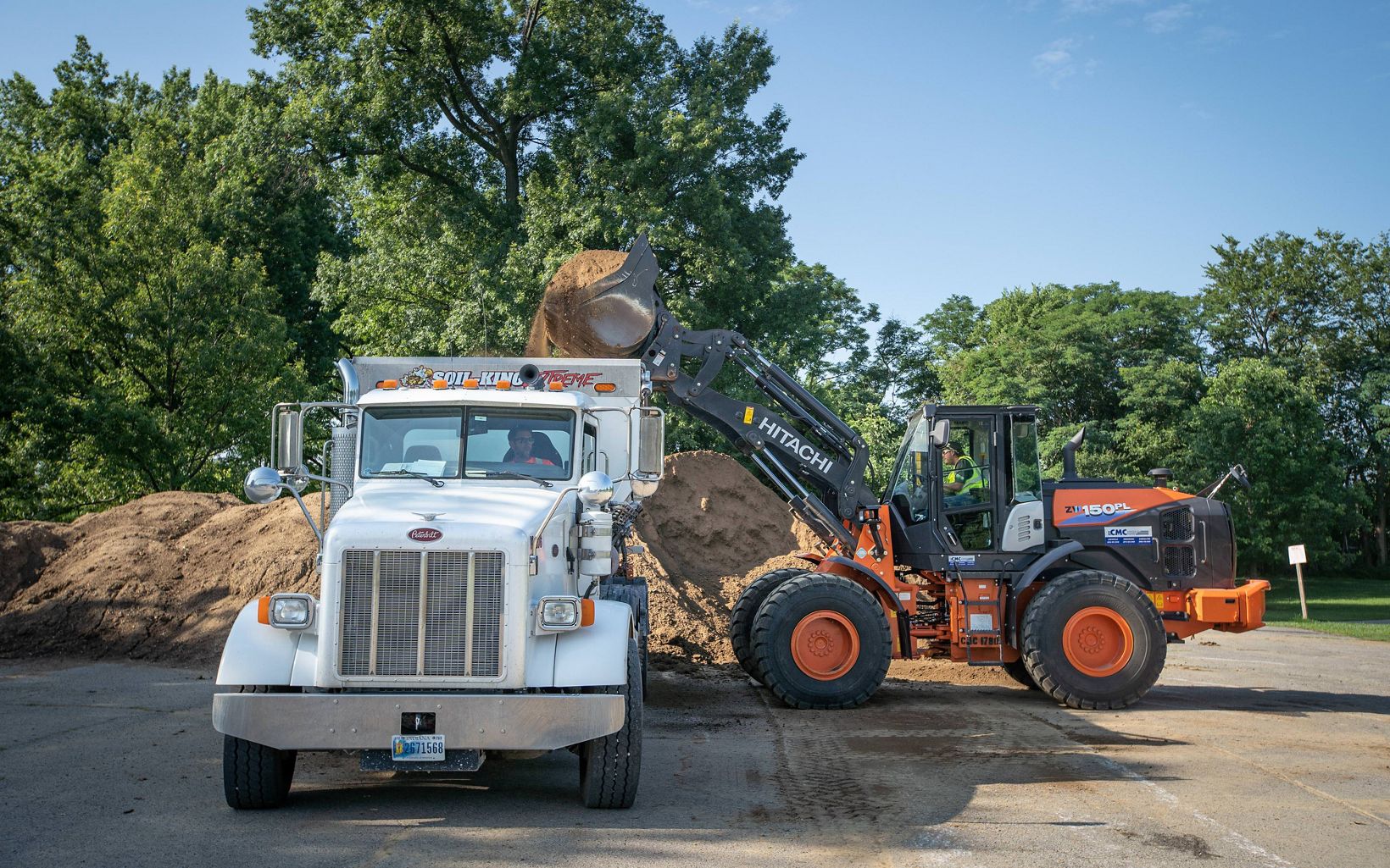 Transporting Soil Soil is loaded into a truck for placement in the Green Heart project's planting areas on a Louisville highway. © Mike Wilkinson