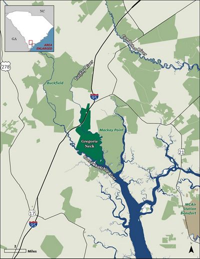 Map with green property boundaries and winding blue creek.