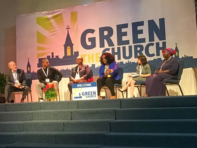Six people sit on a stage during a panel discussion for Green The Church.