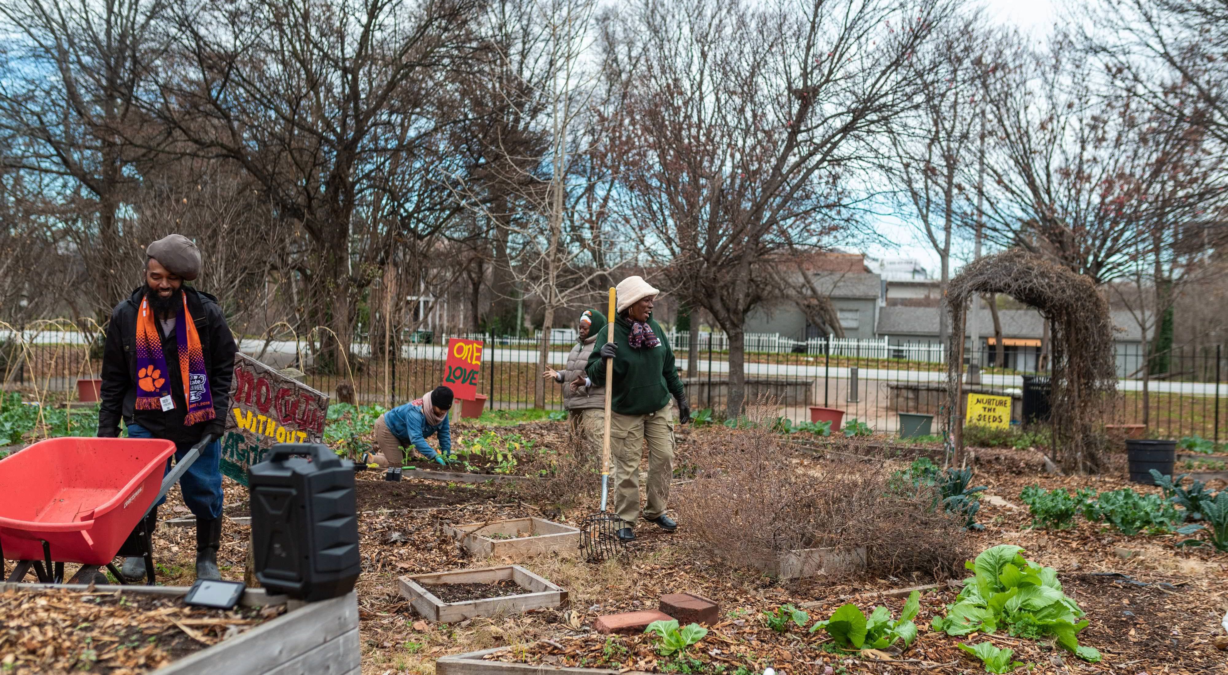 Four people work on urban garden in Atlanta.