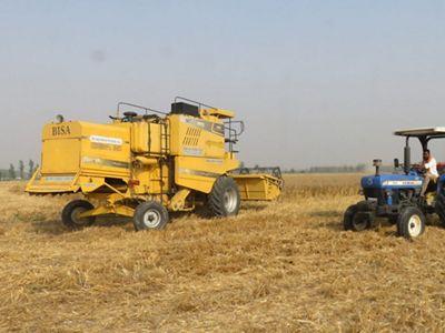 A farmer using “Happy Seeder” technology to clear his fields instead of burning crop residue.