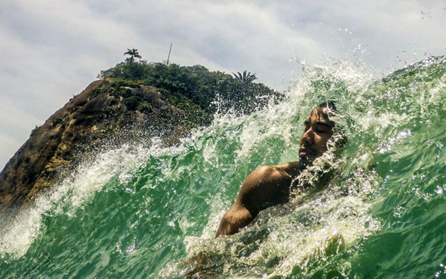 A surfer enjoying a good wave in Copacabana.