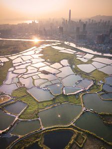 Aerial shot of contrast between urban development and country conservation. 