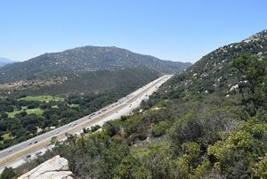 a highway cutting between two mountains