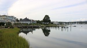 Houses and docks along a bay.