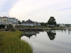 Houses and docks along a bay.