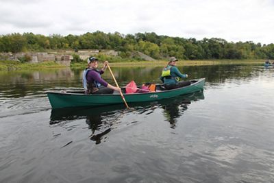 Paddlers kayaking across the Kennebec River.