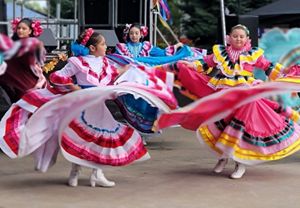Dancers wearing colorful dresses. 
