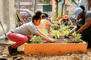 Young girl gardening.